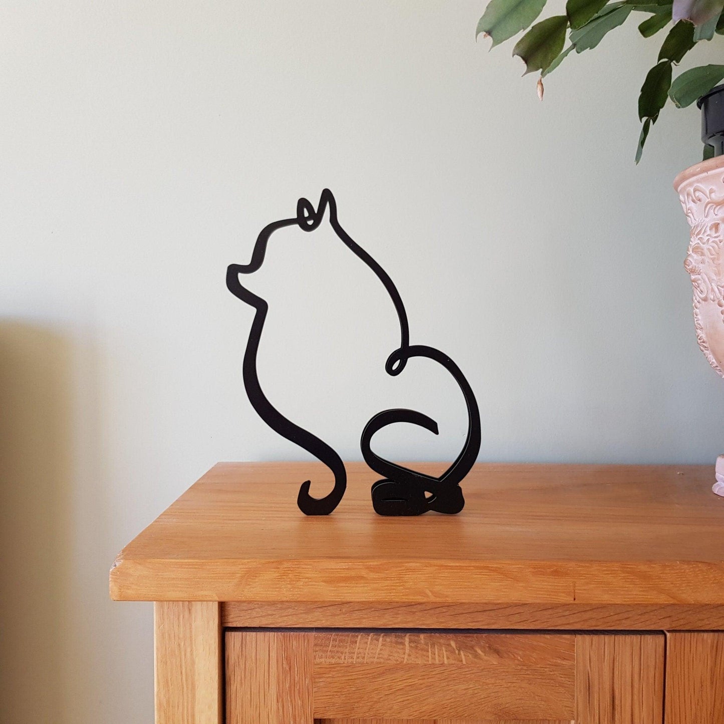pomeranian black metal statue in modern minimalist style