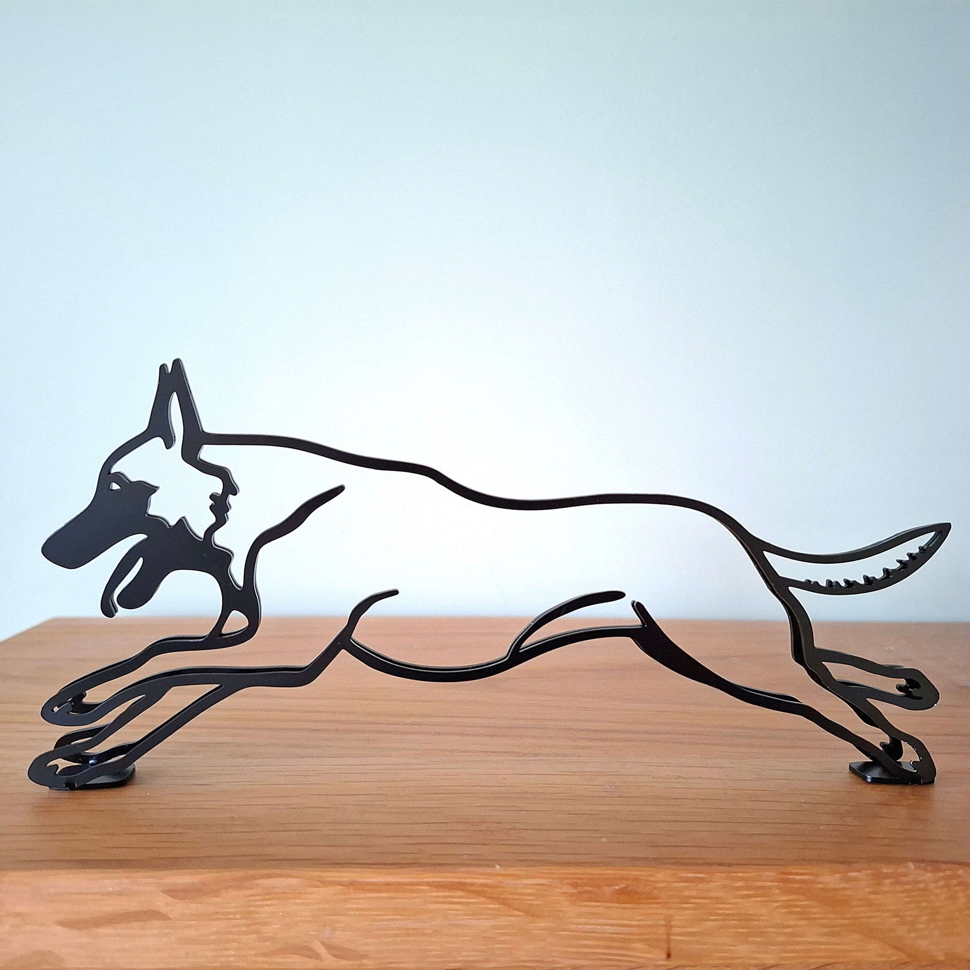 belgian malinois metal statue on display shelf