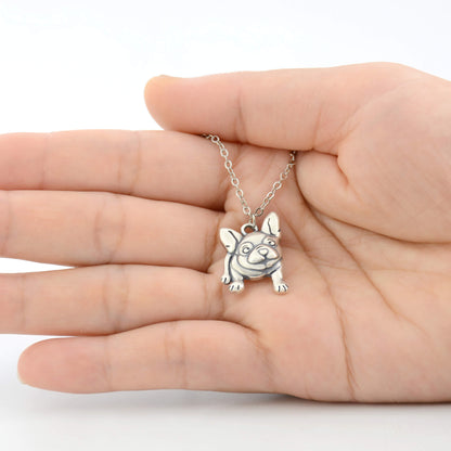 french bulldog charm displayed on hand