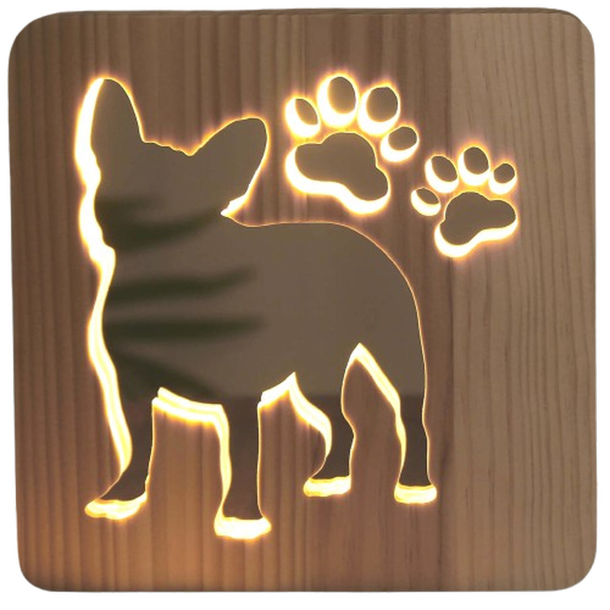 Close-up of the carved French Bulldog and paw prints on the wooden night light