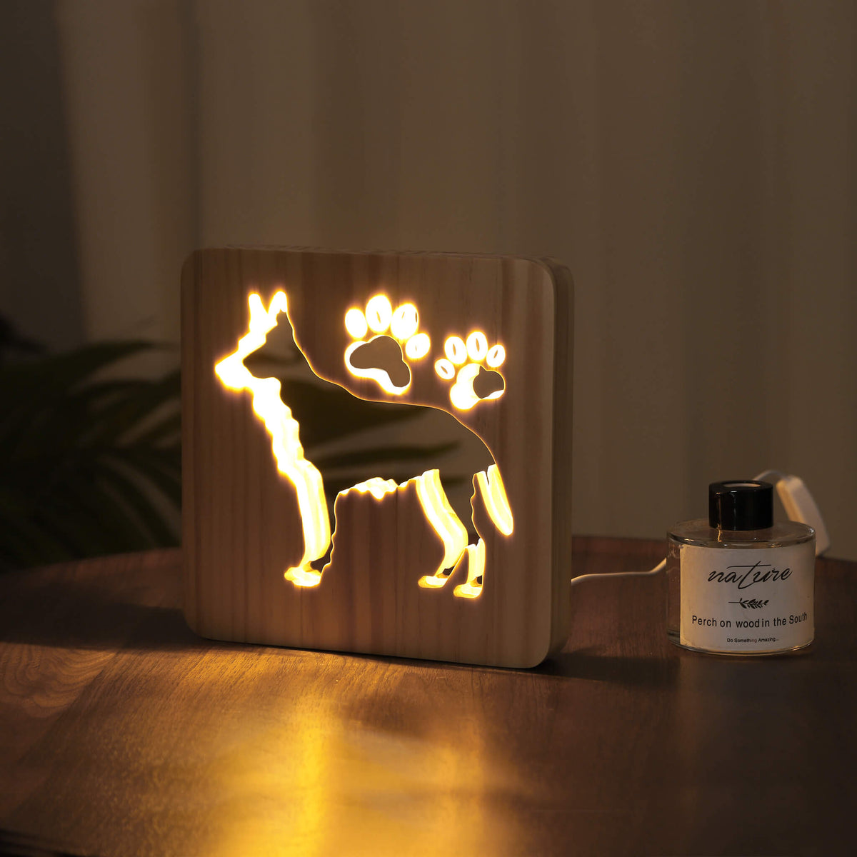 Glowing German Shepherd night light in a dark room