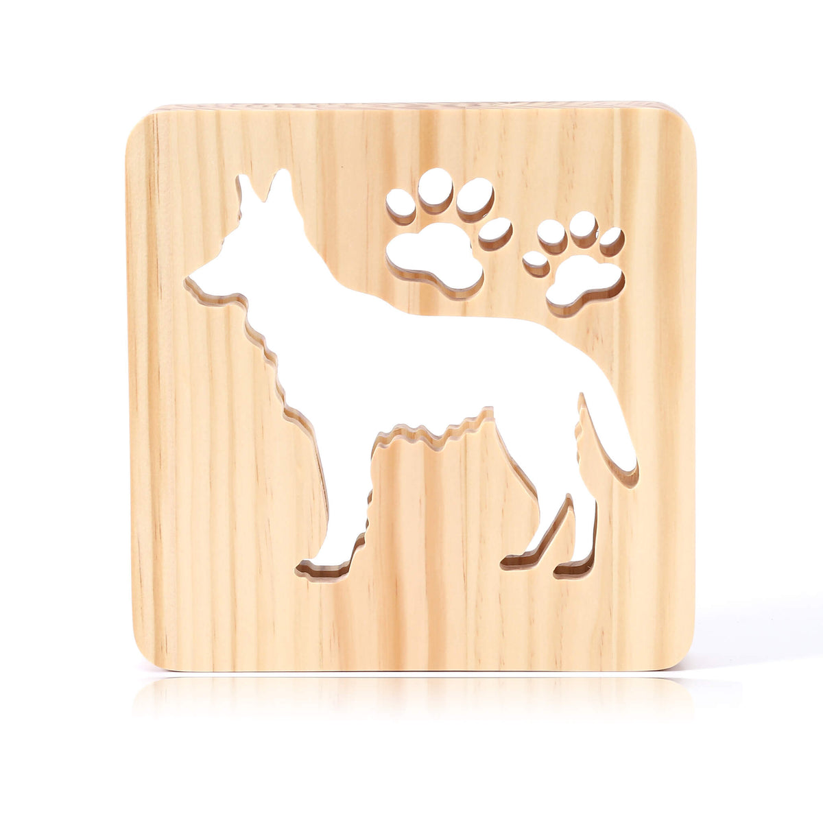 German Shepherd wooden night light switched off, showing the carved dog and paw prints