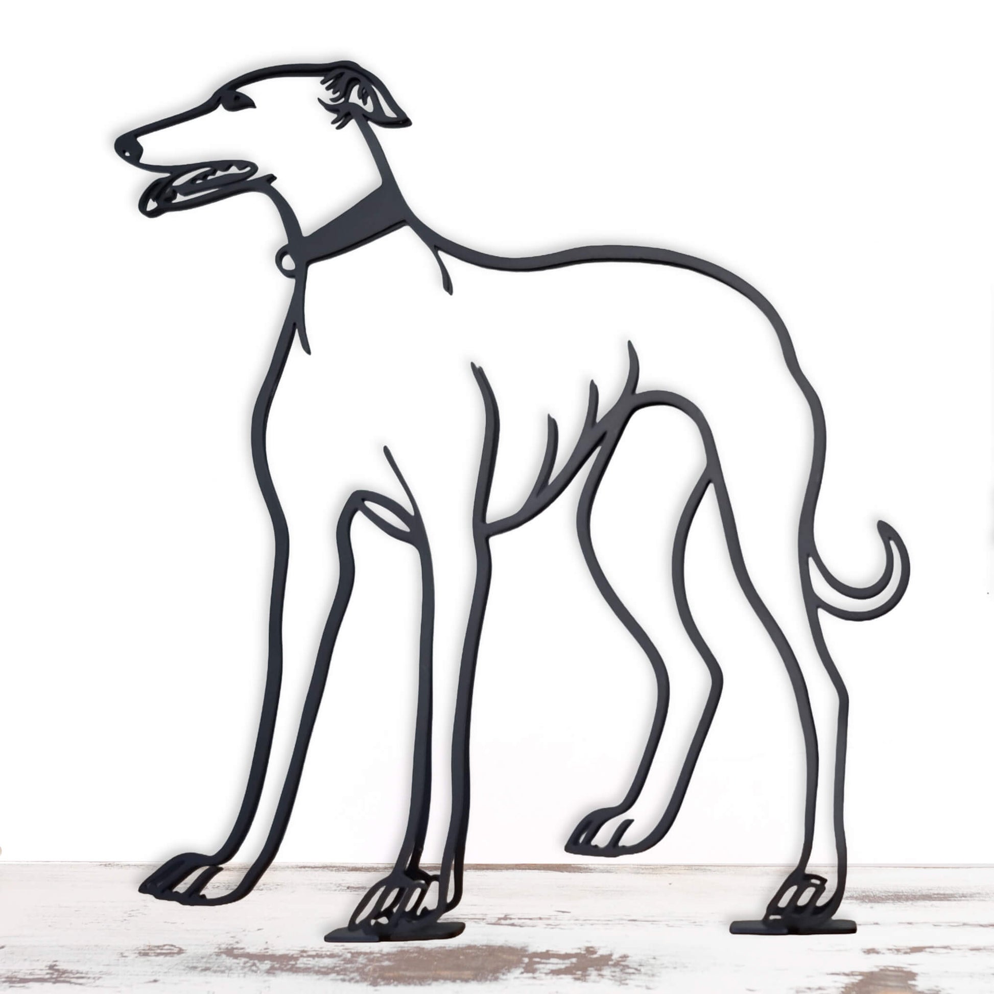 Metal sculpture of a greyhound on a white background