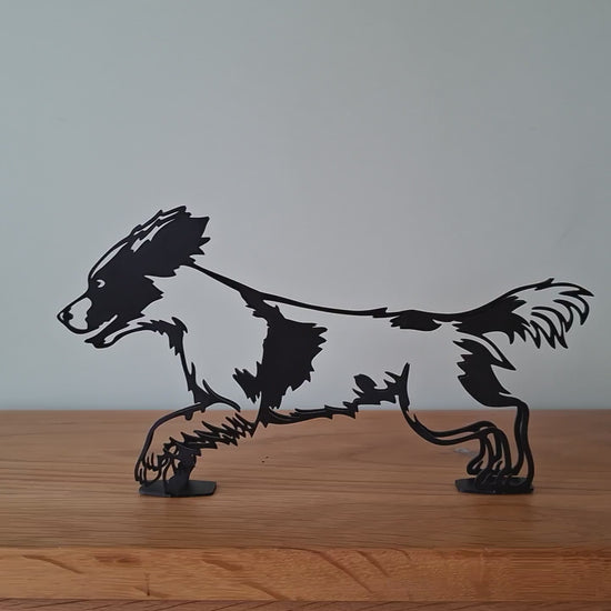 video panning around a springer spaniel metal dog figurine