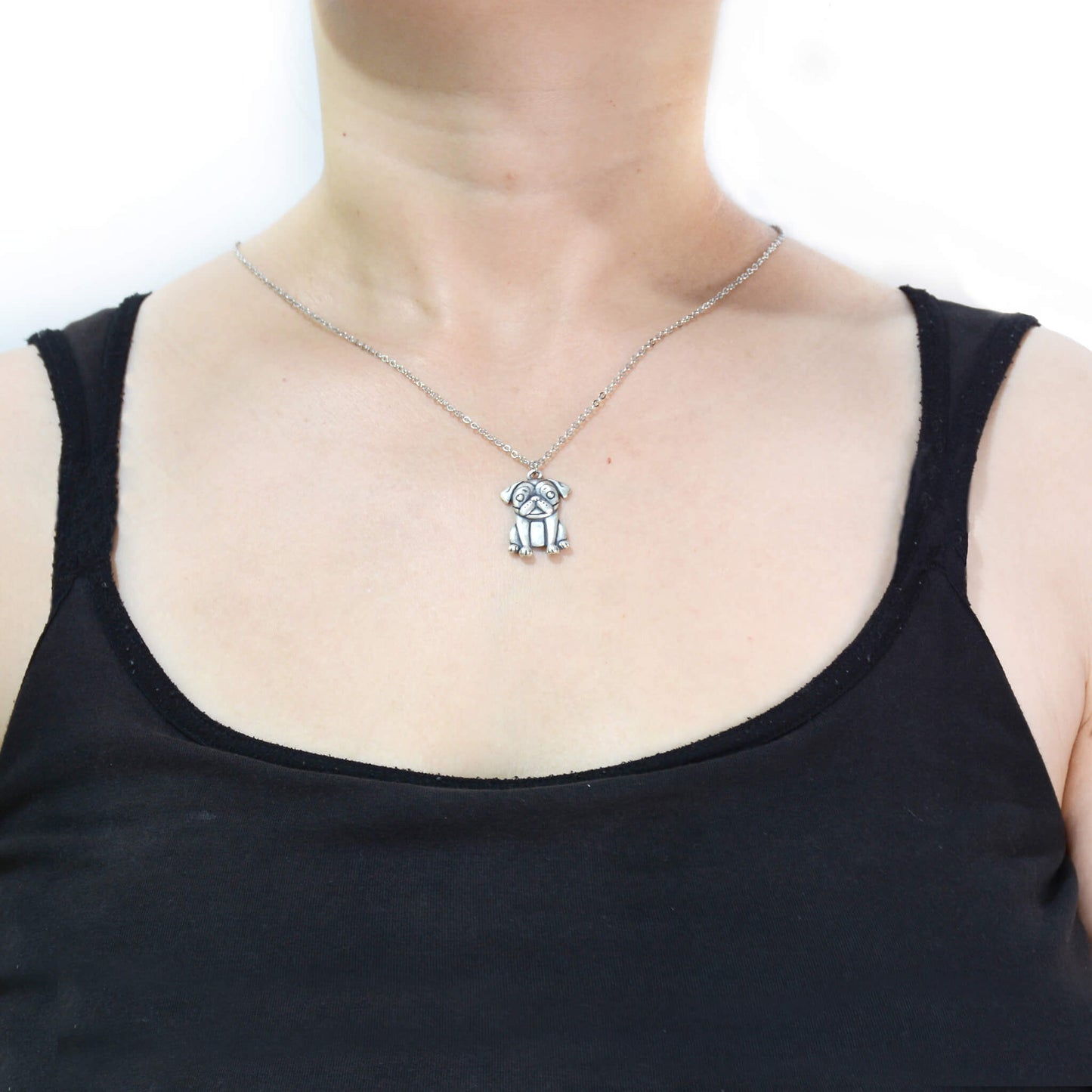 pug charm chain modelled on woman