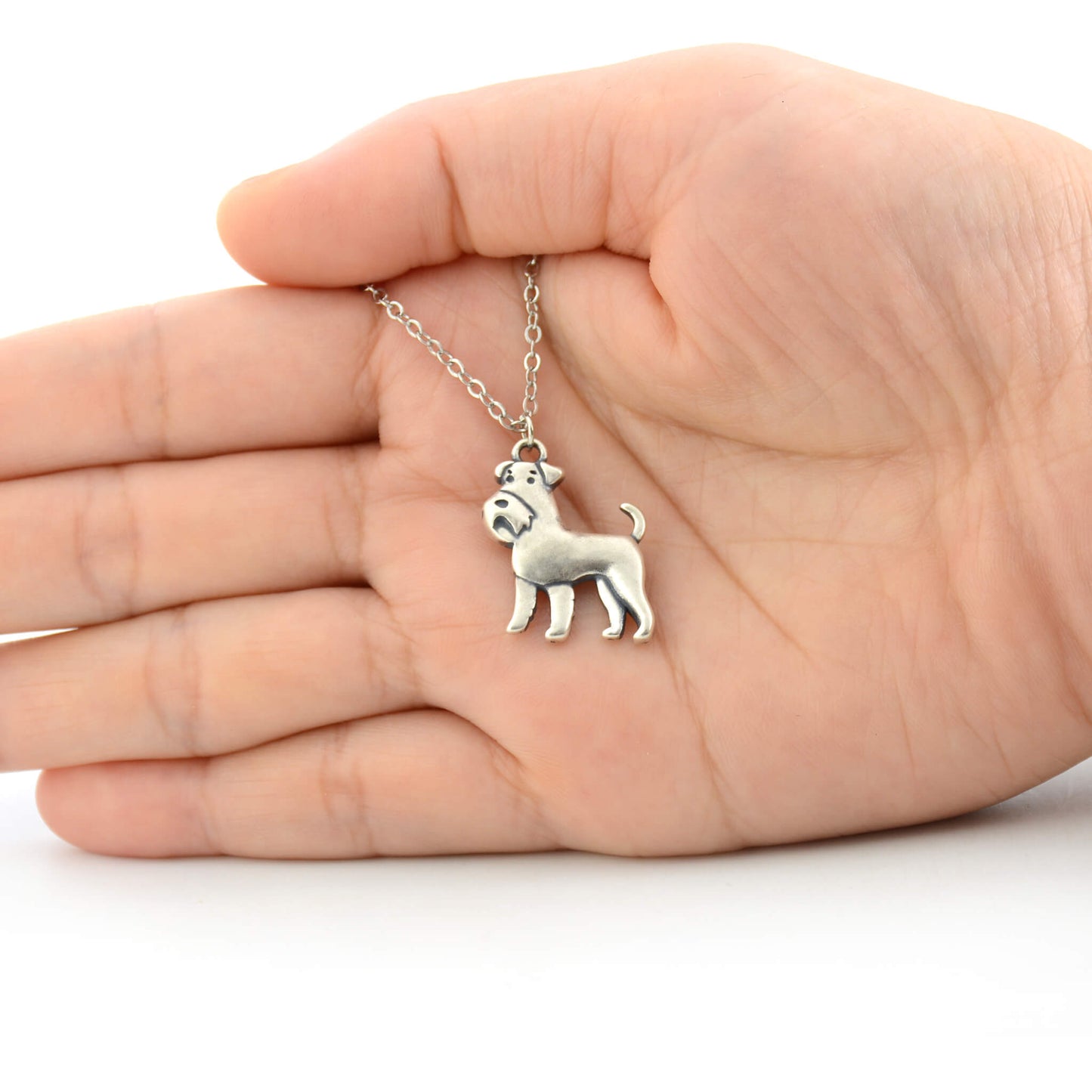 925 silver schnauzer charm size displayed on hand