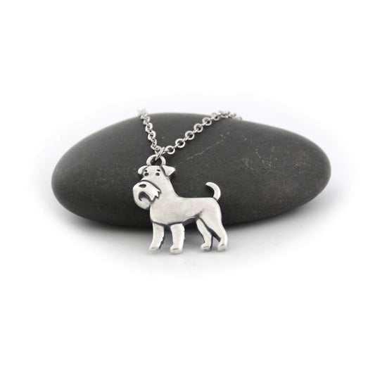 silver schnauzer charm necklace displayed on black pebble