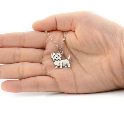 westie 925 silver charm displayed on hand