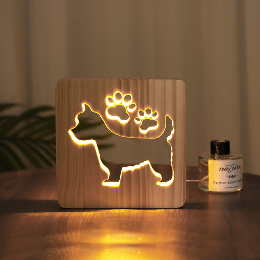 West Highland Terrier wooden LED night light glowing warm yellow on a table
